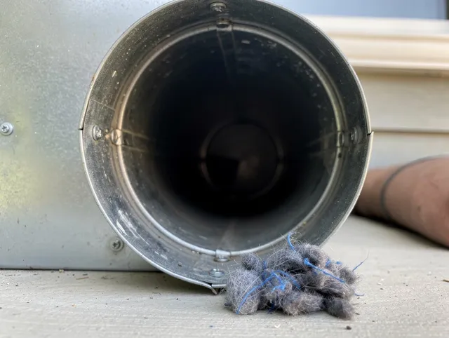 Monrovia Dryer Vent Cleaning technician using specialized equipment to clear severe dryer vent blockage in Monrovia